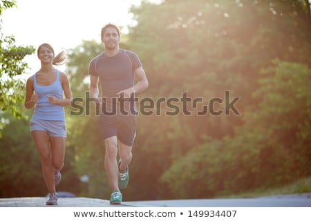 Smiling Sportive Man Running Сток-фото © Pressmaster