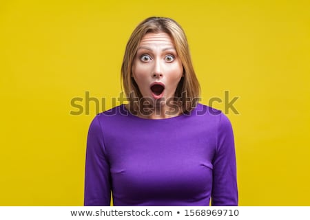 Zdjęcia stock: Shocked Woman With Big Eyes And Open Mouth In Studio