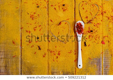 Stock photo: Heart Of Spices And Seasonings White Spoon With Saffron On Curry Background Various Spices Select