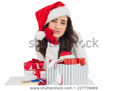 Foto stock: Young Woman Is Packing Present For Christmas Isolated