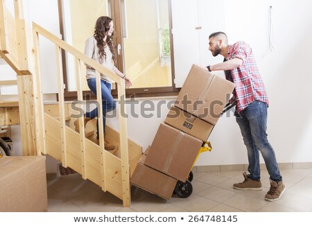 Foto stock: Happy Woman Carrying Tool Box