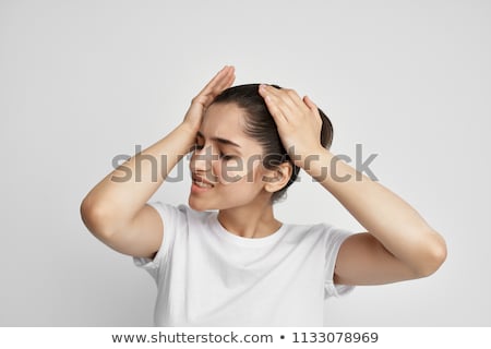 Stock photo: Woman Suffering From A Throbbing Headache