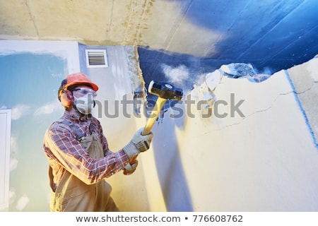 Сток-фото: Worker With A Sledgehammer