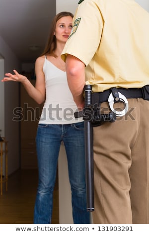 ストックフォト: Police Officer Interrogation Woman At Front Door