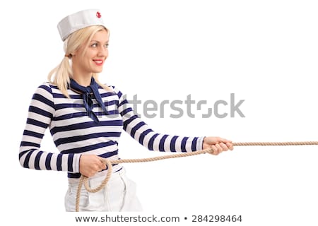 Foto stock: Woman Sailor In Tug Of War Concept