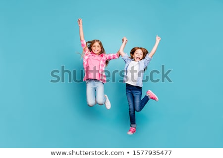 Stockfoto: Happy Little Girl Jumping In Air