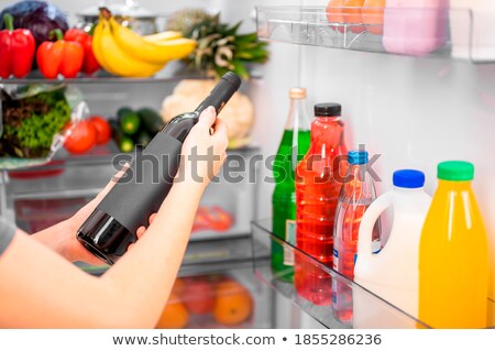 Stockfoto: Shelf Full Of Bottles And Wine Glasses