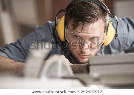 Сток-фото: Man Measuring Wooden Plank