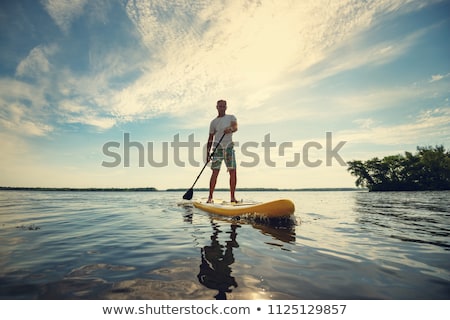 Сток-фото: Surfer Standing On Beach