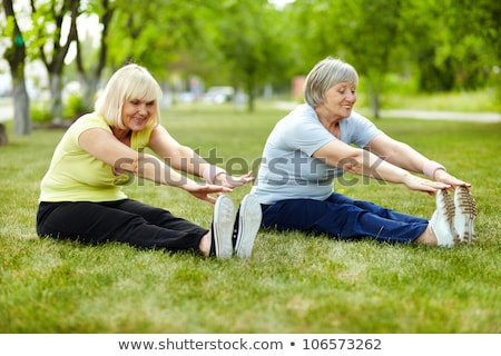 Stok fotoğraf: Senior Lady Enhancing Body Flexibility By Stretching