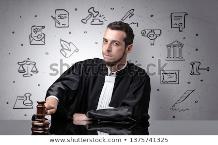 [[stock_photo]]: Young Judge With Court Symbols Around