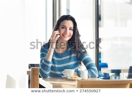 [[stock_photo]]: Teenage Girl With Smartphone And Hot Drink At Cafe