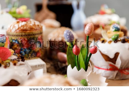 Stock photo: Cupcakes With Chocolate Eggs And Candies On Table