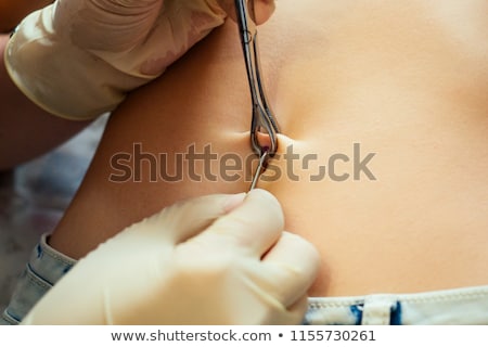 Foto stock: Female Navel With Piercing