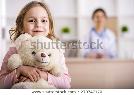 Foto stock: Doctor Examining A Teddy Bear