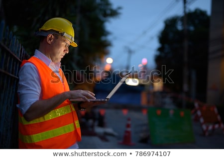 Foto stock: Road Construction Worker With Laptop