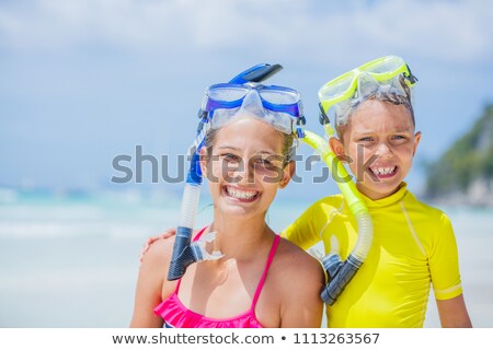 Stok fotoğraf: Brothers Have Fun Diving In The Ocean