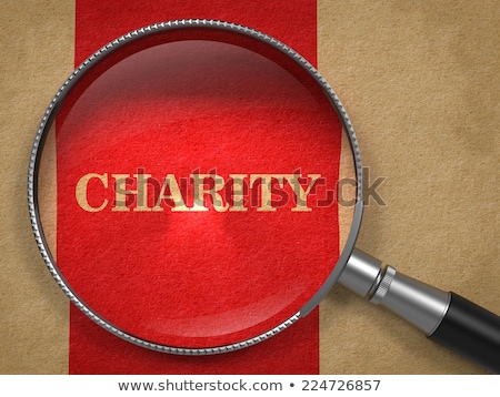 ストックフォト: Donation Through A Magnifying Glass