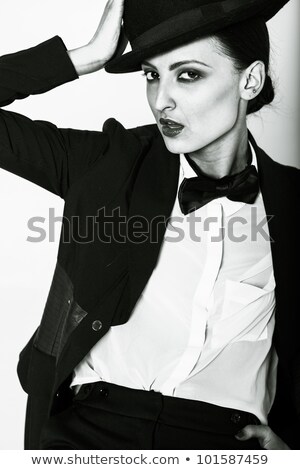 Stock photo: The Woman Legs With A Bow Tie