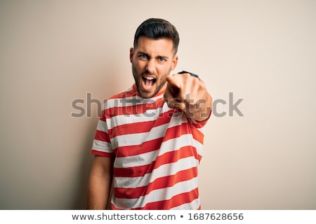 Stock fotó: Mad Furious Young Man Pointing On You And Shouting