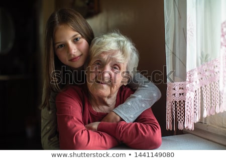 Stock fotó: Beautiful Girl And Her Grandmother