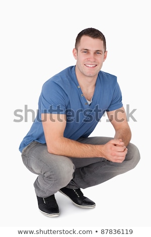 Stock foto: Man In Sitting Squatting Pose On White Background