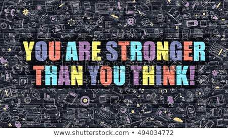 Foto stock: You Are Stronger Than You Think On Dark Brick Wall