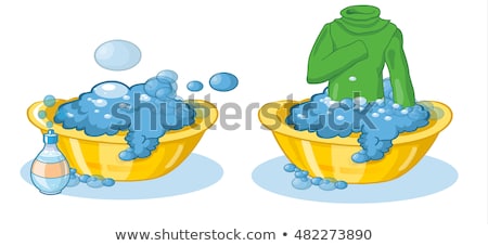 Stock photo: T Shirt In A Basin With Soapy Water Is Washed By Hands