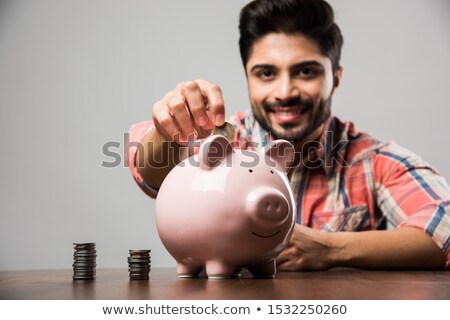 Foto stock: Indian Man Sitting On Bank Safe