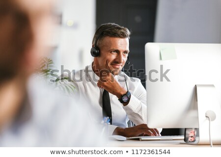 Stok fotoğraf: Photo Of Handsome Man 30s Wearing Office Clothes And Headphones