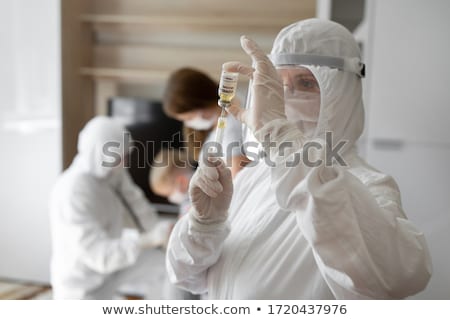 Foto stock: Doctor Injecting Syringe To Patient
