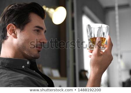 Foto stock: Alcoholic With Glass Drinking Whiskey At Home