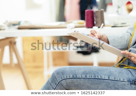 Stock photo: Young Woman Designer Working As Fashion Designers At Work With F