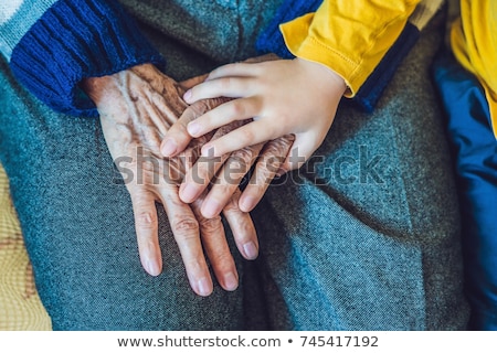 Stockfoto: The Hands Of An Elderly Person And The Hands Of A Child The Continuity Of Generations The Care Of