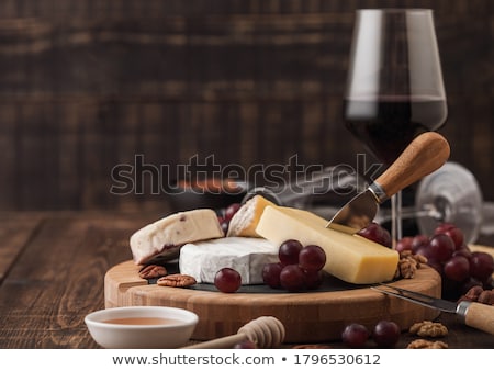 Foto d'archivio: Selection Of Various Cheese On The Board On Wooden Table Background Blue Stilton Red Leicester And