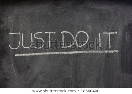 Foto stock: Just Do It Handwritten With White Chalk On A Blackboard