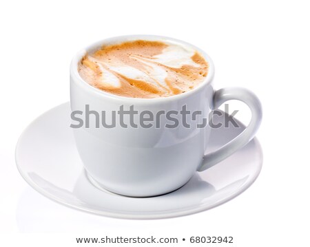 Foto d'archivio: White Mug Full Of Coffee With Foam In A Swirl