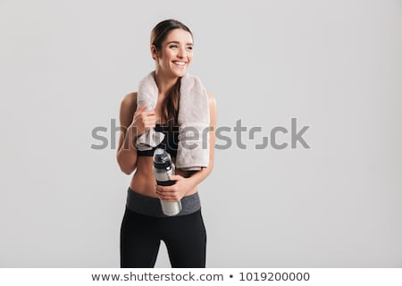 Stockfoto: Attractive Woman Posing With A Bottle