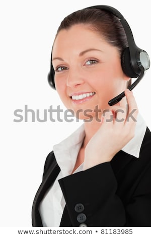 Foto d'archivio: Attractive Woman Posing With Headphones While Standing Against A White Background