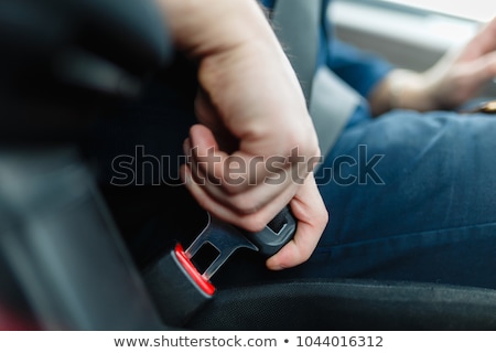 Stockfoto: Man Hand Fastening A Seat Belt In The Car