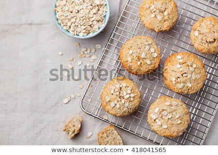 Stok fotoğraf: Healthy Vegan Oat Muffins Apple And Banana Cakes On A Cooling Rack Top View Copy Space