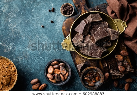 Stockfoto: Dark Chocolate Pieces Crushed And Cocoa Beans Culinary Background Top View