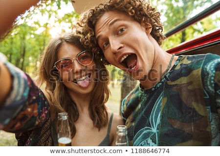 Zdjęcia stock: Photo Of Amusing Hippie Couple Man And Woman Smiling And Taking