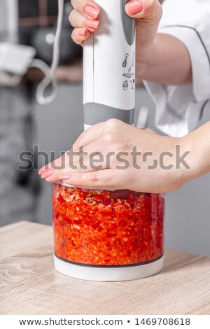 Stock fotó: Cook Interrupts Red Pepper In A Blender