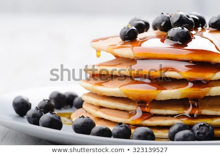 Foto stock: Pancakes With Blueberries And Maple Syrup