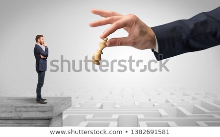 Stockfoto: Little Businessman From The Top Of The Labyrinth Thinking About Strategies