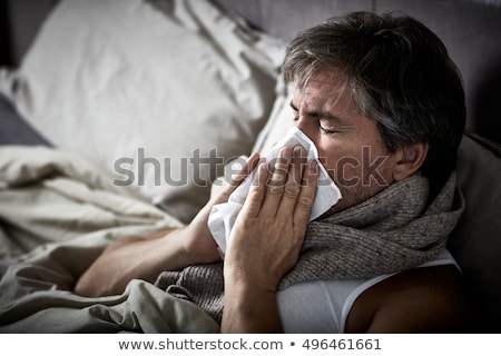 Stock foto: Sick Man Suffering From Flu In The Bed