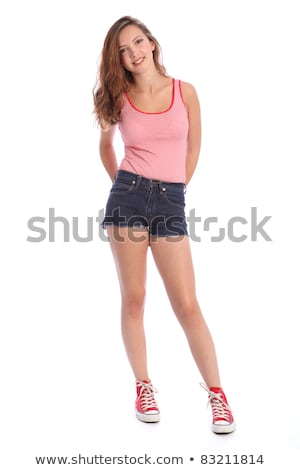 [[stock_photo]]: Teenager Girl In Denim Shorts And Vest Happy Smile