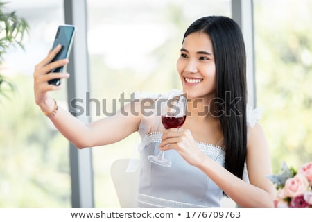 Foto stock: Couple Holding Wine Glasses