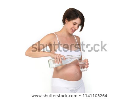 ストックフォト: Pregnant Woman Filling Glass Of Water